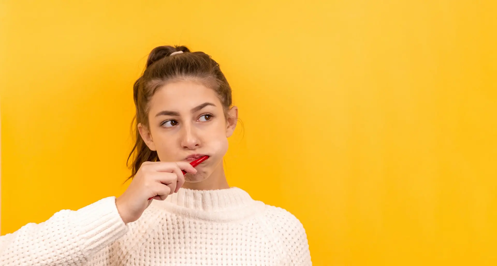 girl brushing her teeth