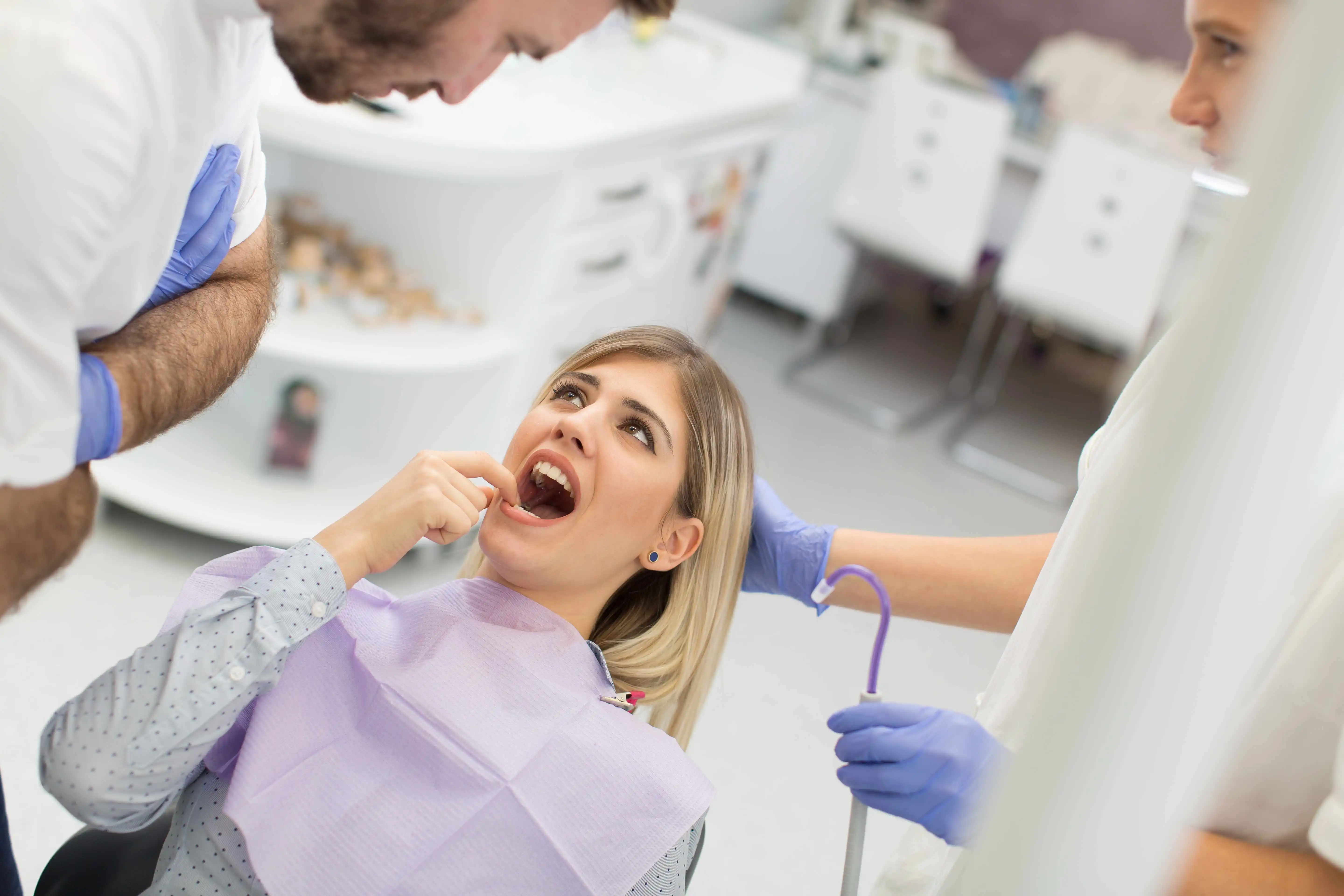 woman pointing out gum recession